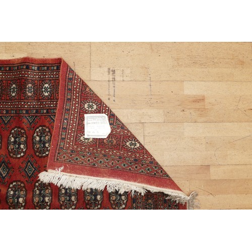 574 - A hand-knotted Teke Turkmen Bokhara Deluxe rug, with a fringe trim, the Teke design is inspired by e... 