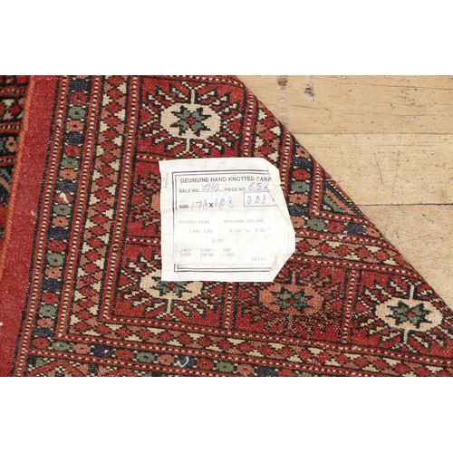 574 - A hand-knotted Teke Turkmen Bokhara Deluxe rug, with a fringe trim, the Teke design is inspired by e... 