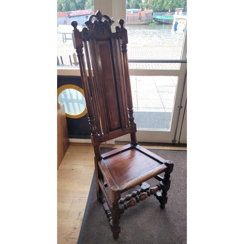 580 - A late 19th early 20th century oak high backed hall chair, shaped pierced top rail above a chamfered... 