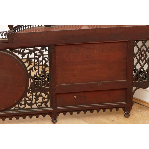 581 - An Edwardian mahogany wall-mounted over mantle display shelf, having central circular mirror, flanke... 