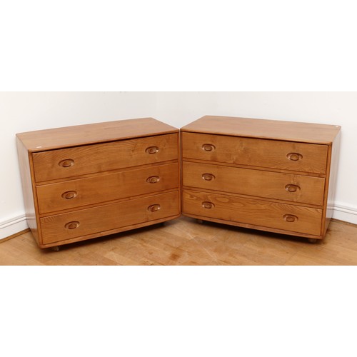 583 - A pair of 1960s Ercol 'Windsor' low chest of drawers, model 412 in light elm, having three long draw... 