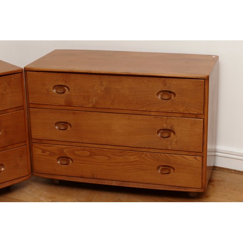 583 - A pair of 1960s Ercol 'Windsor' low chest of drawers, model 412 in light elm, having three long draw... 