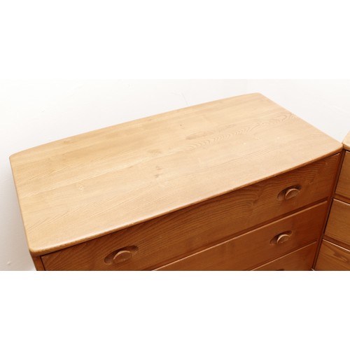 583 - A pair of 1960s Ercol 'Windsor' low chest of drawers, model 412 in light elm, having three long draw... 