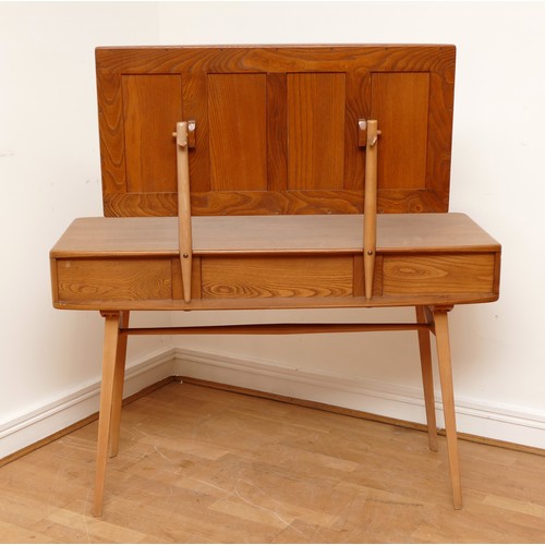 584 - A 1960s Ercol 'Windsor' light elm dressing table and chair, the rounded rectangular top mounted by r... 