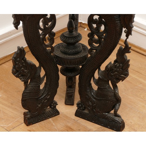 588 - A late 19th century Anglo Indian carved padouk centre table, the circular top with vine decoration, ... 