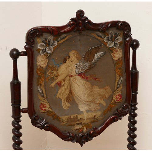 589 - A Victorian mahogany fire screen, scrolled foliage carved pediment, shield frame enclosing figural n... 