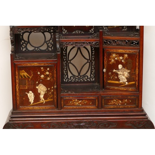 592 - A late 19th century Japanese hardwood Shibayama cabinet, Meiji period (1868-1912) with profusely car... 