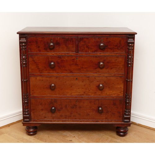 593 - A Victorian mahogany chest of two short and three long drawers with bun handles and turned columns, ... 