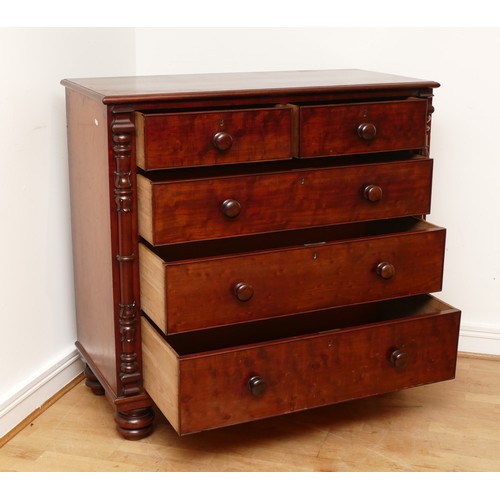 593 - A Victorian mahogany chest of two short and three long drawers with bun handles and turned columns, ... 