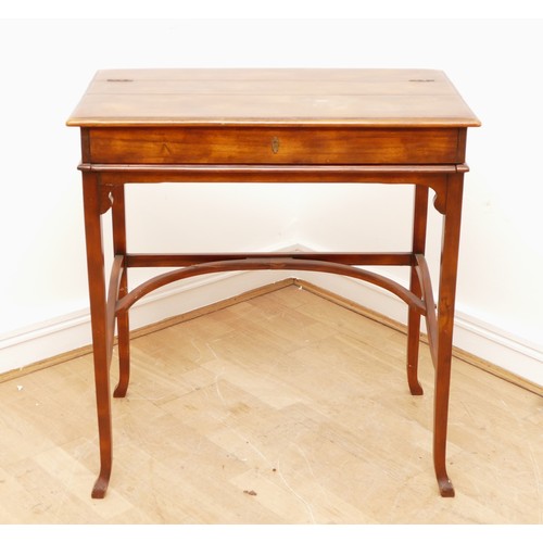 595 - A Victorian mahogany ladies writing desk, the hinged top of rectangular form opening to a slide out ... 