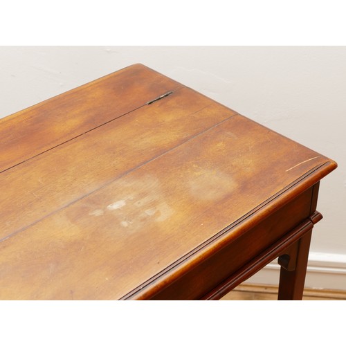 595 - A Victorian mahogany ladies writing desk, the hinged top of rectangular form opening to a slide out ... 