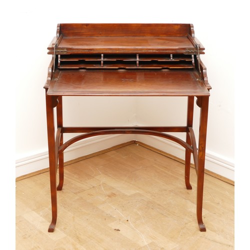 595 - A Victorian mahogany ladies writing desk, the hinged top of rectangular form opening to a slide out ... 