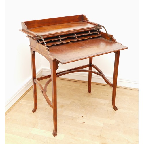 595 - A Victorian mahogany ladies writing desk, the hinged top of rectangular form opening to a slide out ... 