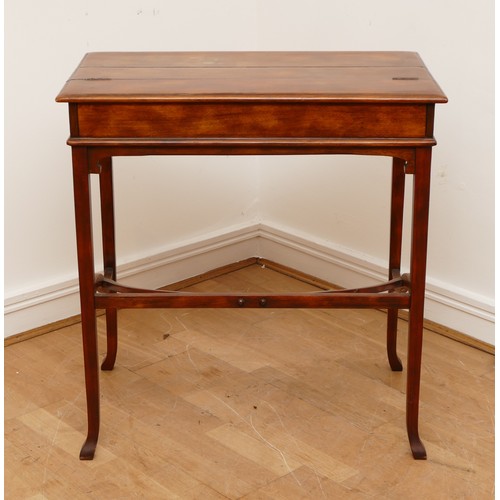 595 - A Victorian mahogany ladies writing desk, the hinged top of rectangular form opening to a slide out ... 