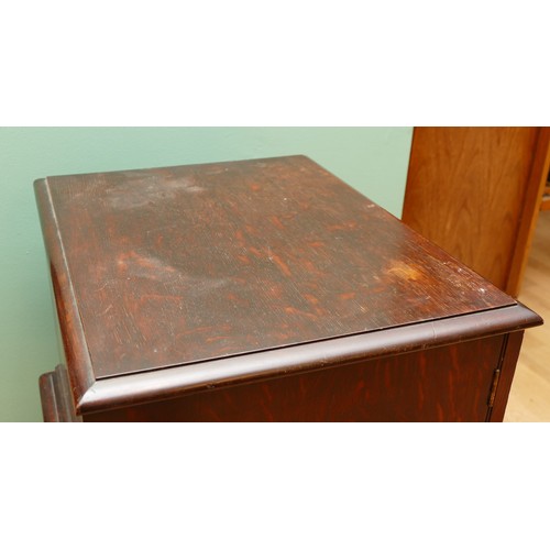 596 - A late 19th century oak canteen side cabinet, the two glazed doors opening to a bank of four drawers... 