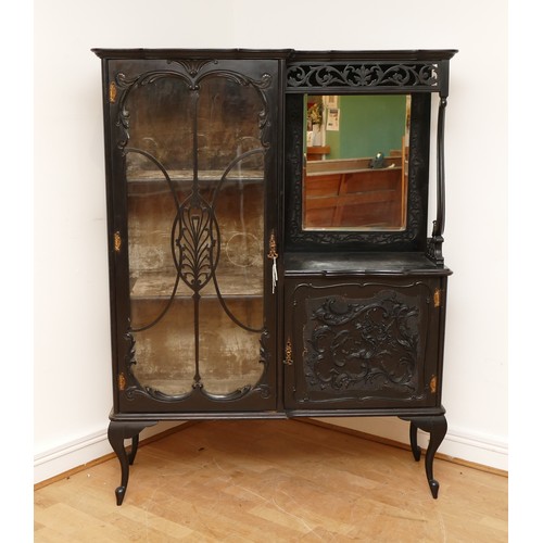 598 - An Edwardian ebonised Rococo style display cabinet, having moulded cornice above a glazed astragal d... 