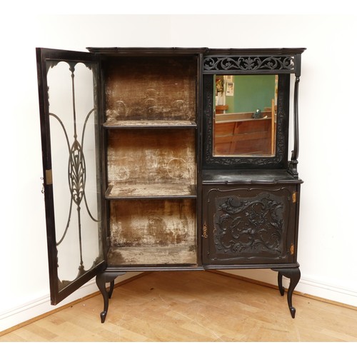 598 - An Edwardian ebonised Rococo style display cabinet, having moulded cornice above a glazed astragal d... 