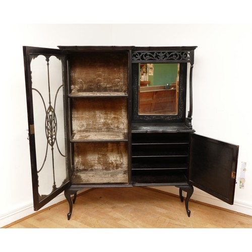 598 - An Edwardian ebonised Rococo style display cabinet, having moulded cornice above a glazed astragal d... 