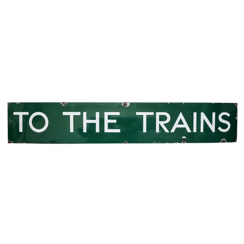 A B.R (British Railways) enamel sign 'To The Trains' white lettering on a green background, 180 x 31cm.