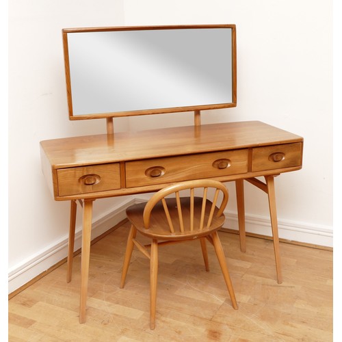 584 - A 1960s Ercol 'Windsor' light elm dressing table and chair, the rounded rectangular top mounted by r... 