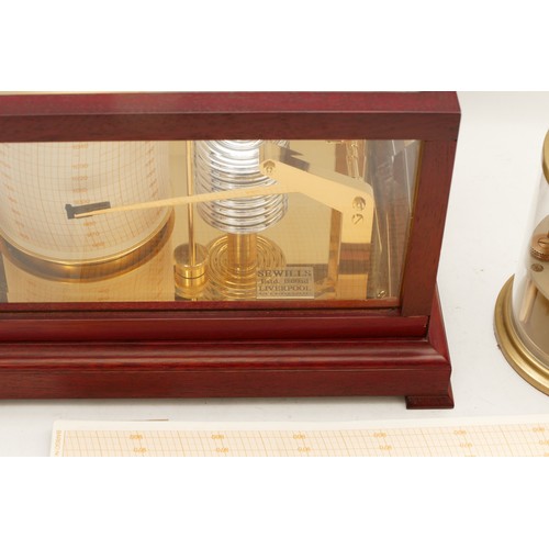 101 - A mid-twentieth century barograph, housed in a bevelled glass, mahogany framed display case, togethe... 