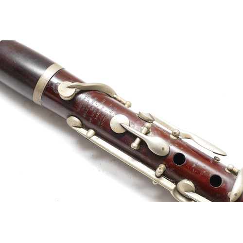 102 - A late 19th century Chappell & Co Ltd rosewood clarinet, having four section body, nickel plated mou... 