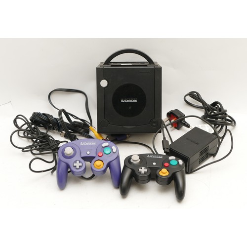 103 - A Nintendo Game Cube console, with two joysticks and AC lead.