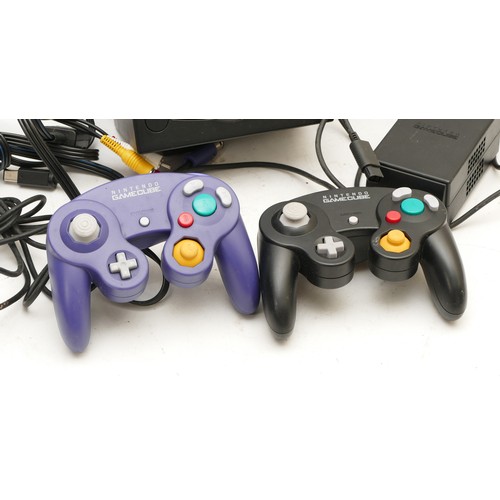 103 - A Nintendo Game Cube console, with two joysticks and AC lead.