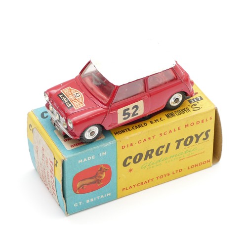 122 - Corgi Toys; A BMC Mini Cooper S Monte Carlo, box numbered 317, red/white with red interior and chrom... 