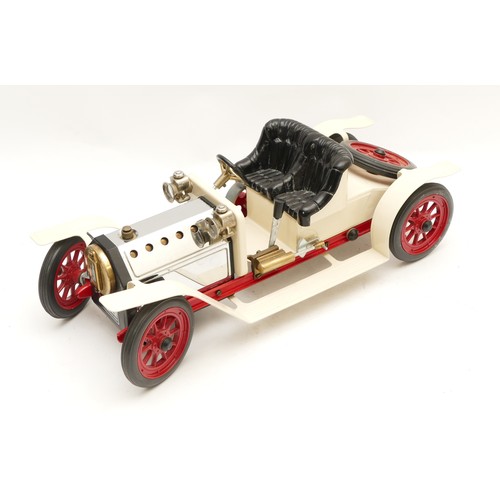 140 - A Mamod live steam roadster car with white body, black seat and red spoked wheels, with burner, unfi... 