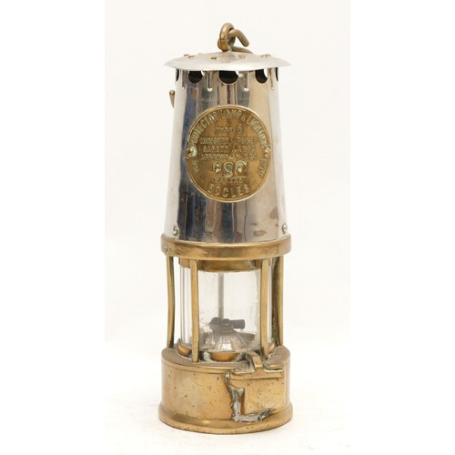 192 - A brass Eccles miners lamp, type 6, with applied makers plaque stamped 080, 25cm tall.