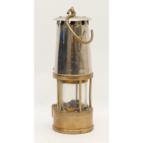 192 - A brass Eccles miners lamp, type 6, with applied makers plaque stamped 080, 25cm tall.