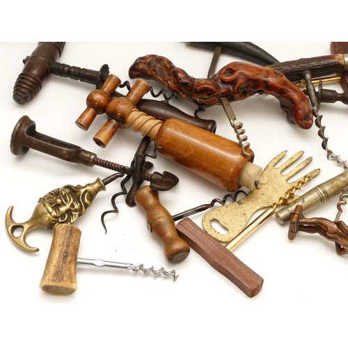 210 - A collection of over ten modern and antique corkscrews and bottle openers, to include mounts depicti... 