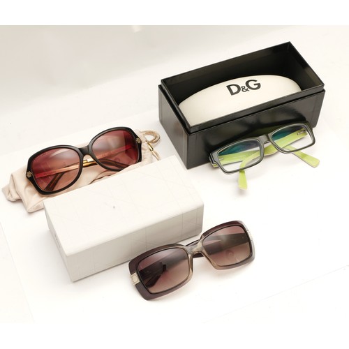 229 - Three pairs of designer sun and reading glasses, to include, a pair of Christian Dior frames, serial... 