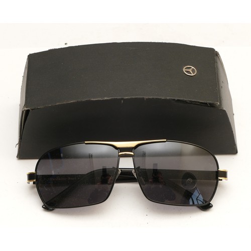 231 - A pair of Mercedes Benz branded sunglasses, serial no. MB722 65 12-142, complete with case.