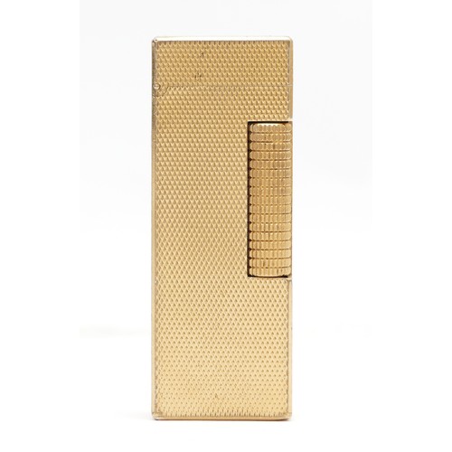 232 - Alfred Dunhill; A Dunhill gold plated rollagas pocket cigarette lighter, engine turned case with rel... 