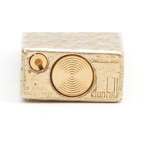 233 - Alfred Dunhill; A Dunhill rollagas gold plated pocket cigarette lighter.