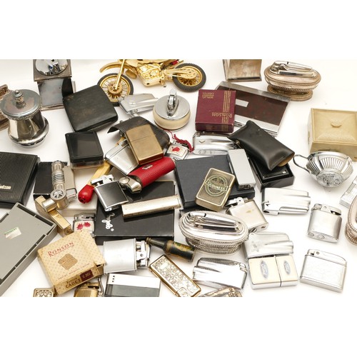 237 - A collection of mid 20th century and later pocket and table cigarette lighters, petrol and gas opera... 