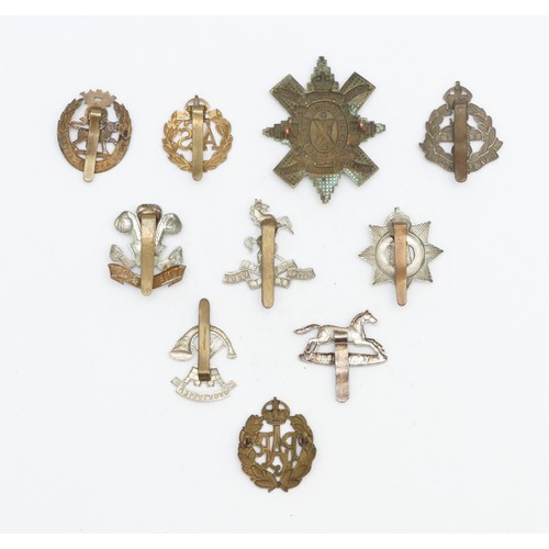 257 - 10x Military cap badges, to include The Welch, East Lancashire and Yorkshire.