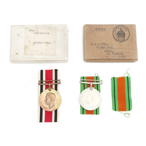 353 - WWII pair of the Special Constabulary Service medal and Defence, presented to 1344 Arnold Fell. Lanc... 