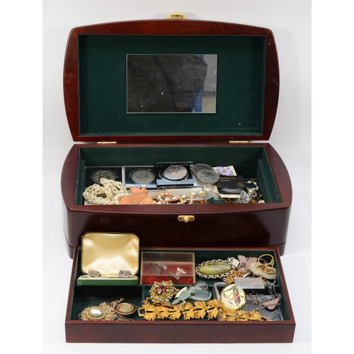 32 - A collection of costume jewellery and coins to include watches, pendants, brooches and a 1950s 