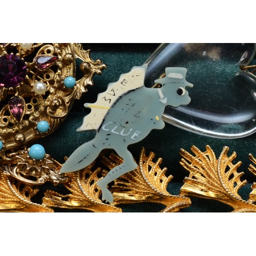 32 - A collection of costume jewellery and coins to include watches, pendants, brooches and a 1950s 