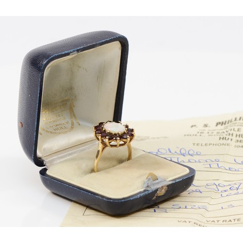 33 - A 9ct gold opal and garnet cluster ring, 10mm x 7mm opal, R, with original box and receipt, 4g