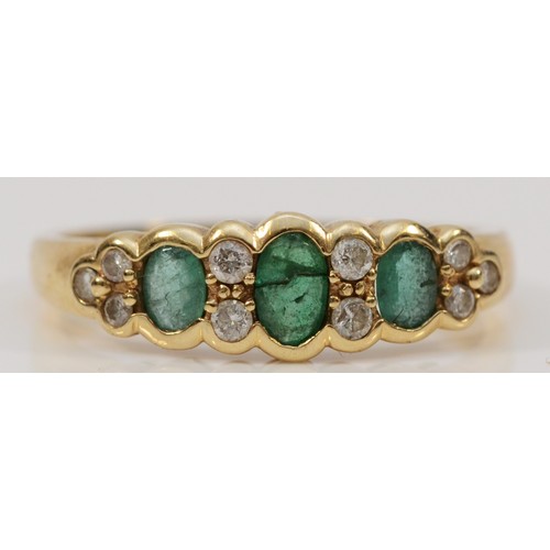 35 - A 9ct gold emerald and brilliant cut diamond dress ring, three emeralds the central of which is crac... 