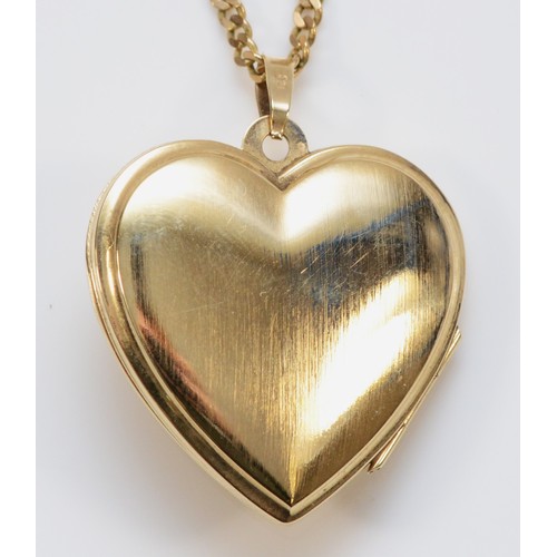 37 - A 9ct gold heart shaped locket with chain, floral engraving to the front of the locket, 25mm heart l... 