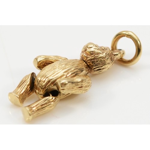 42 - A 9ct gold pendant in the form of a bear with articulated arms and legs and movable head, 23mm lengt... 