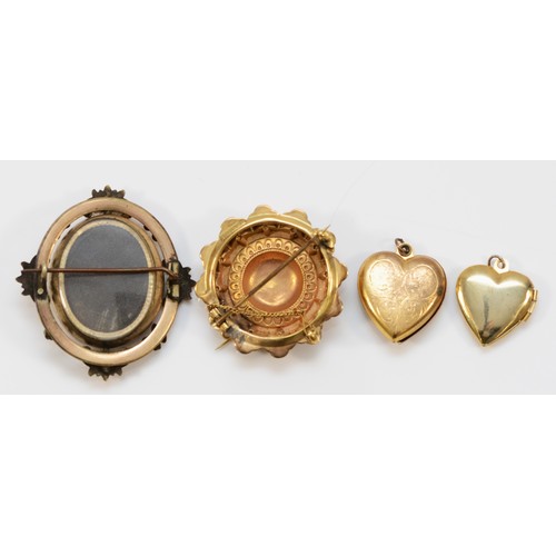 44 - A 9ct gold Victorian brooch with safety chain, 35mm diameter, 5.2g, together with two heart shaped l... 