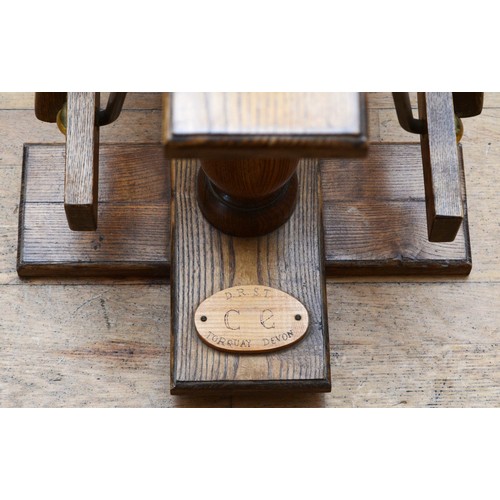 59 - An oak rocking horse, with chestnut mane and tail, on a trestle rocker frame supported by dual balus... 