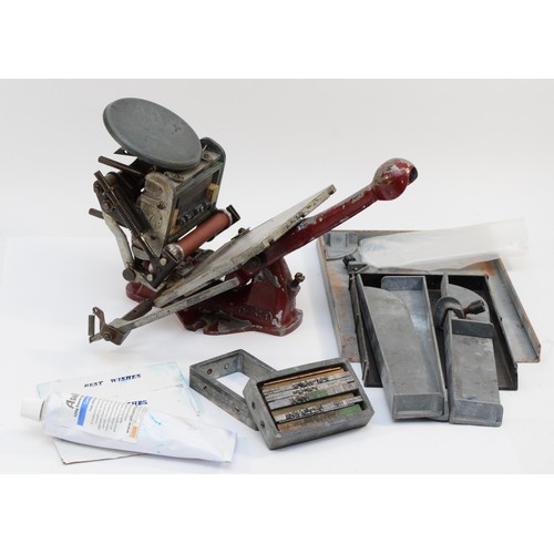 61 - An Adana letter press, no. 781146 and 800575, with an assortment of accessories, to include, an Adan... 