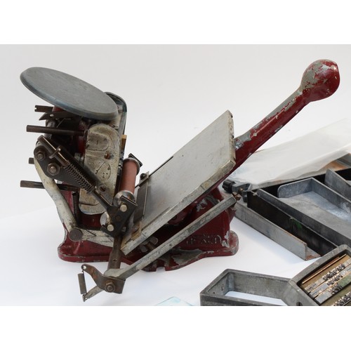 61 - An Adana letter press, no. 781146 and 800575, with an assortment of accessories, to include, an Adan... 